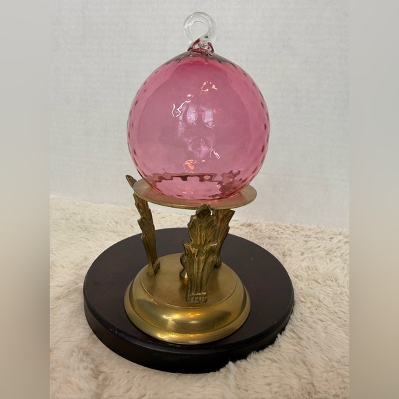 Handblown pink glass witch ball/decorative ornament with vintage brass stand